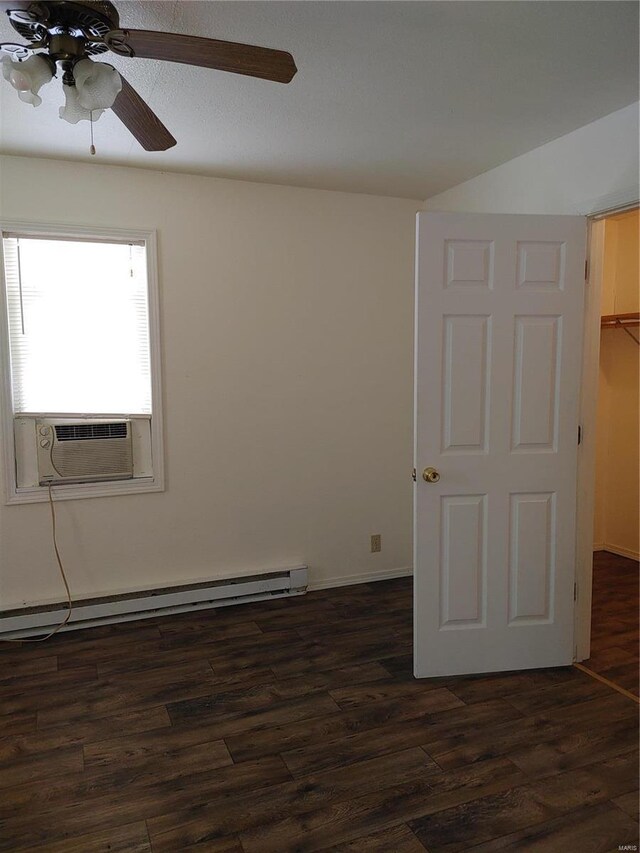 unfurnished room with baseboard heating, ceiling fan, cooling unit, and dark hardwood / wood-style flooring