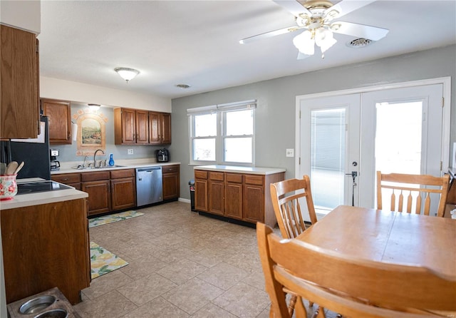 kitchen featuring french doors, sink, black refrigerator, stainless steel dishwasher, and ceiling fan