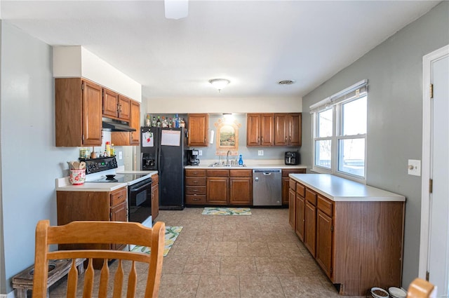 kitchen featuring range with electric cooktop, sink, stainless steel dishwasher, and black fridge with ice dispenser