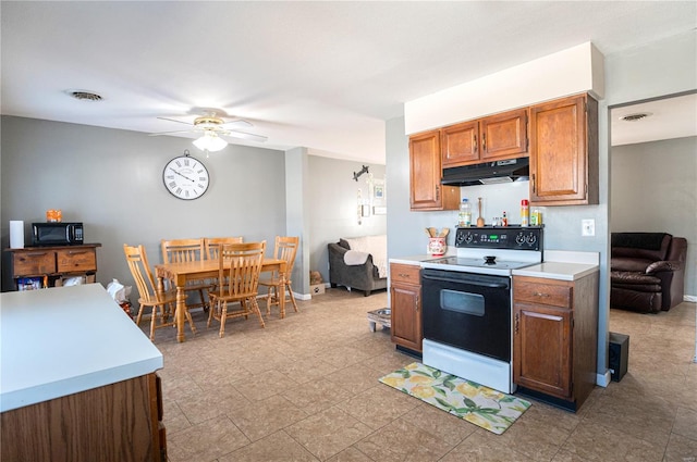 kitchen featuring electric range oven and ceiling fan