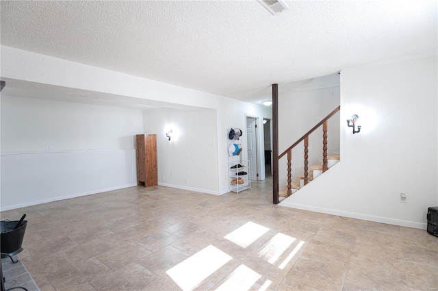 basement with a textured ceiling