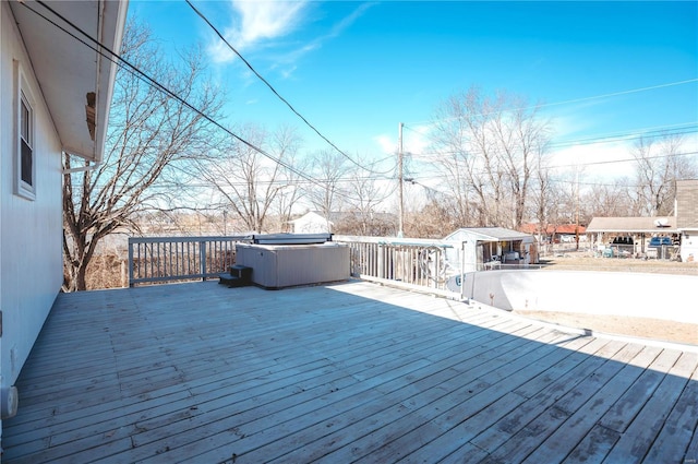 deck featuring a hot tub