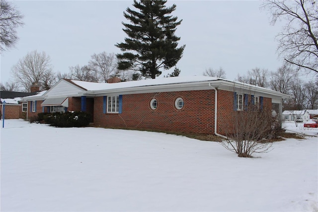 view of snow covered property