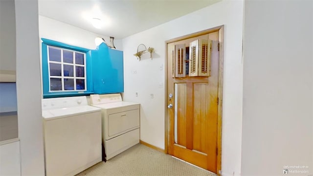 clothes washing area with washer and dryer