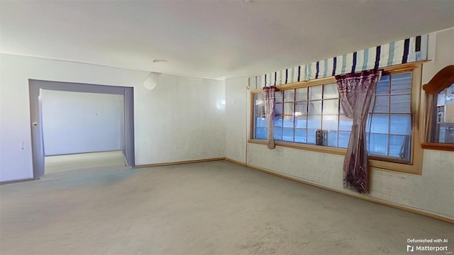 unfurnished room featuring carpet