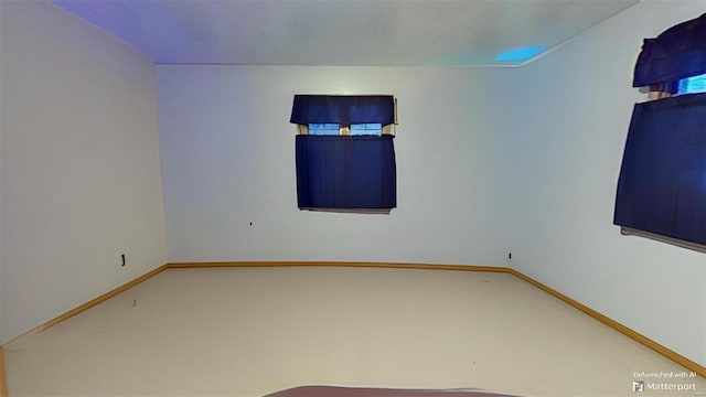 spare room featuring carpet