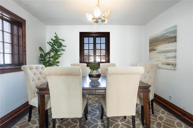 dining room featuring an inviting chandelier and plenty of natural light