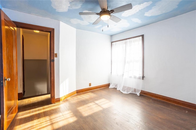 spare room featuring ceiling fan and hardwood / wood-style floors