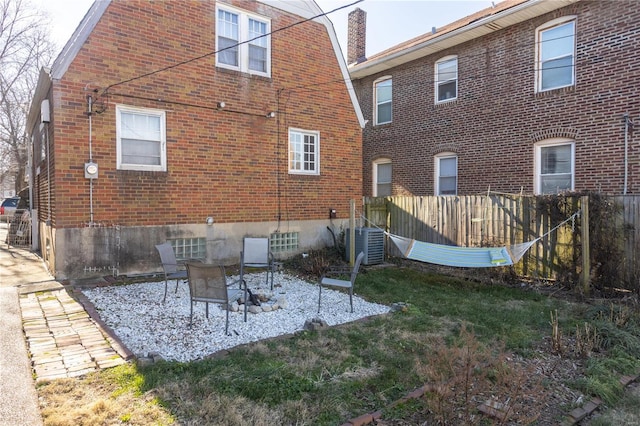 rear view of house featuring a patio area and cooling unit