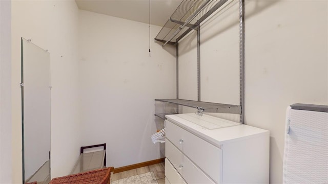 spacious closet featuring light wood-type flooring