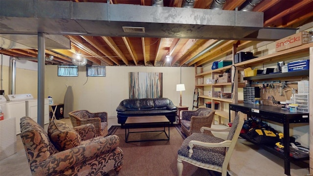 basement with washer and clothes dryer