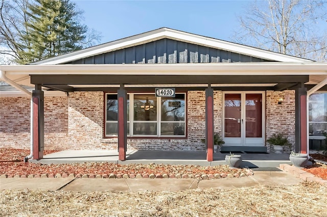 doorway to property featuring french doors and covered porch