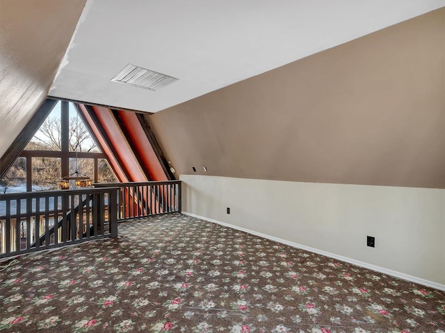 additional living space with lofted ceiling and carpet floors