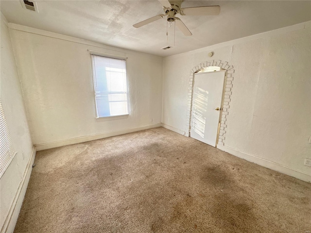 carpeted empty room featuring ceiling fan