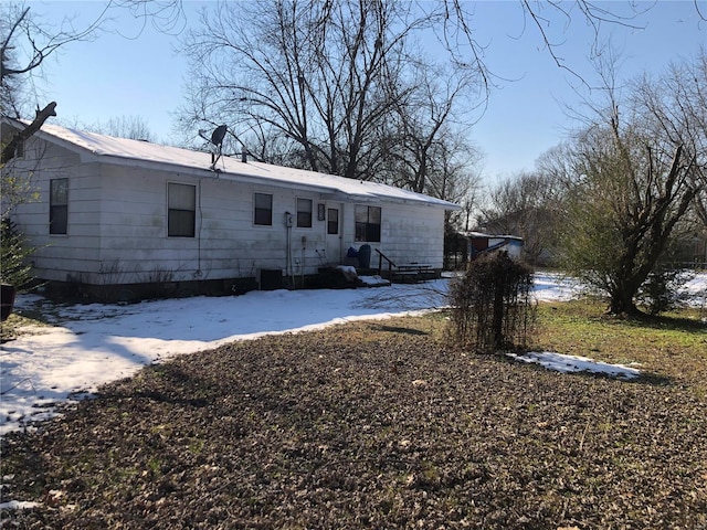 view of snow covered property