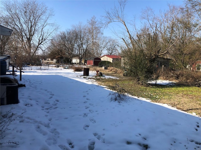 view of yard layered in snow