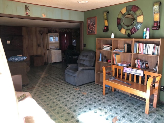 sitting room featuring wood walls