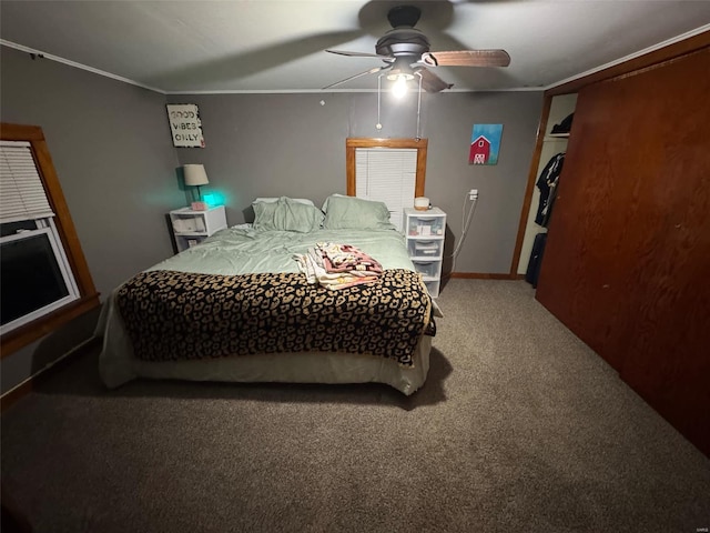 bedroom with ceiling fan, carpet, and ornamental molding