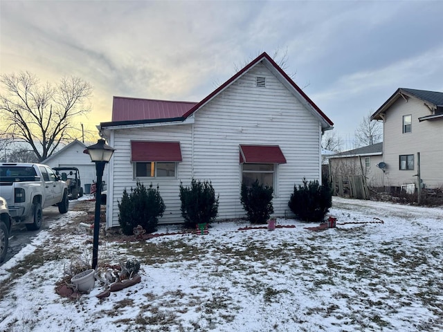 view of snow covered house