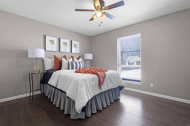 bedroom with ceiling fan and dark hardwood / wood-style flooring