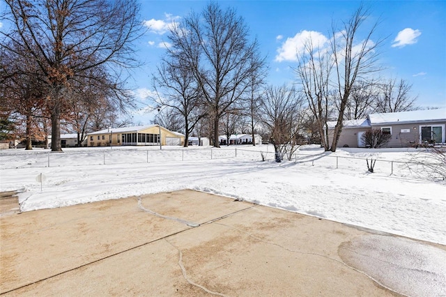 view of yard layered in snow