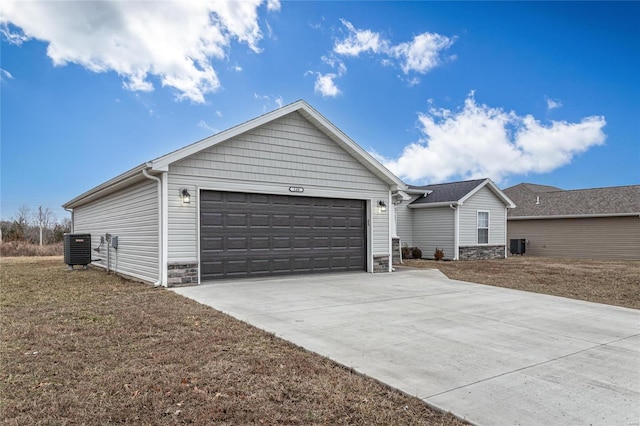 ranch-style house with a garage and cooling unit