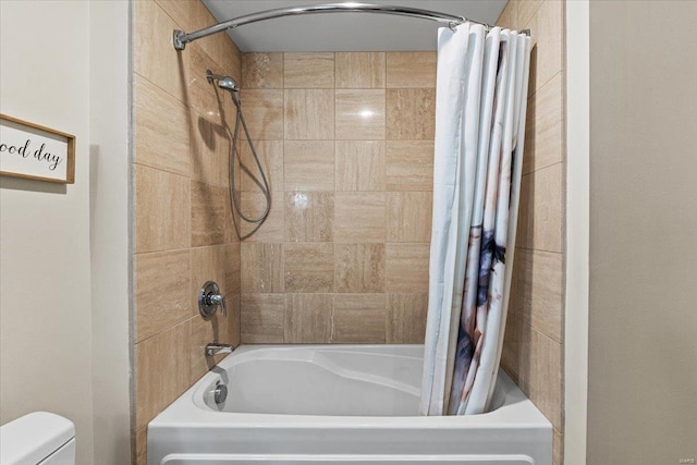 bathroom featuring shower / tub combo with curtain and toilet