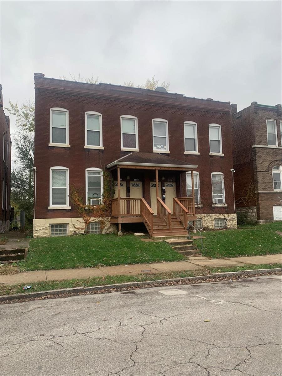 townhome / multi-family property with covered porch