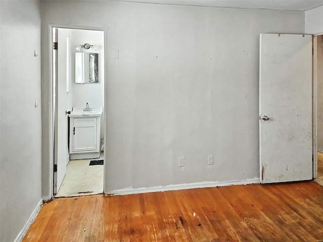 empty room with light hardwood / wood-style floors