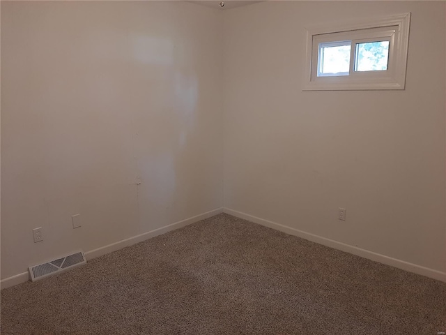 spare room featuring carpet