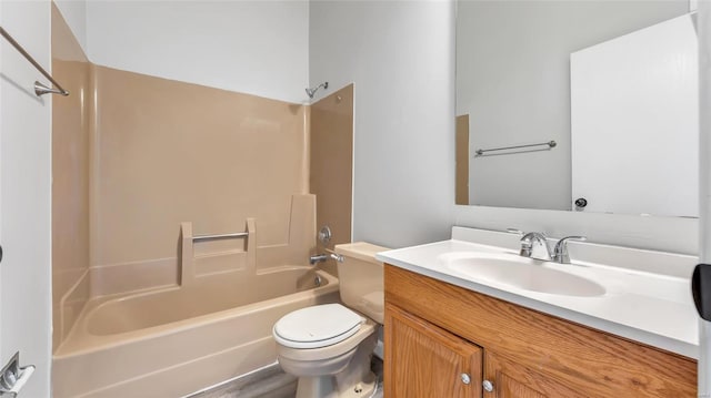 full bathroom featuring vanity, washtub / shower combination, and toilet