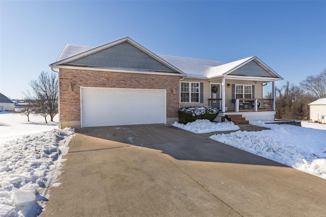 single story home featuring a garage and a porch