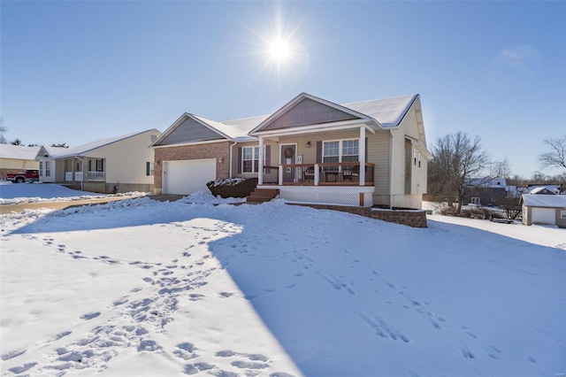 single story home featuring covered porch and a garage