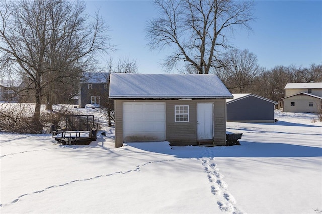 view of snow covered garage