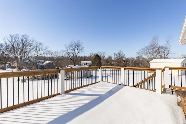 view of snow covered deck