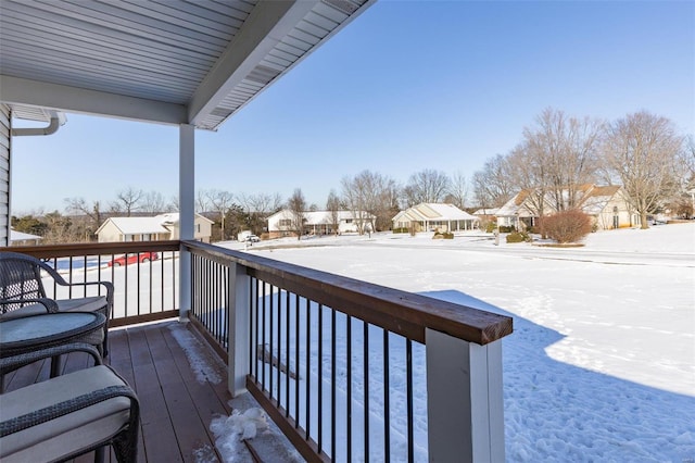 view of snow covered deck