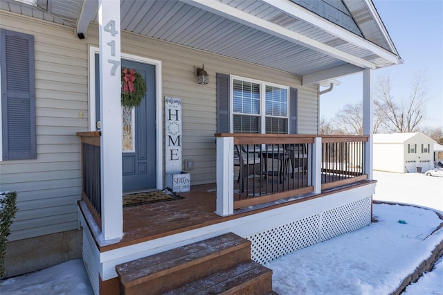 view of snow covered property entrance