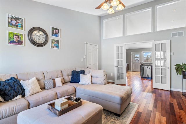 living room with french doors, ceiling fan, and dark hardwood / wood-style floors