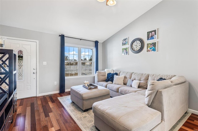 living room featuring vaulted ceiling and dark hardwood / wood-style flooring