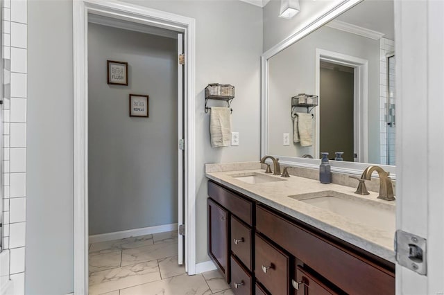 bathroom with ornamental molding and vanity