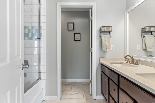 bathroom with vanity and tiled shower / bath combo