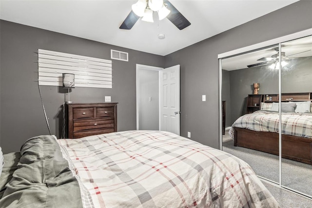 bedroom with a closet, ceiling fan, and carpet