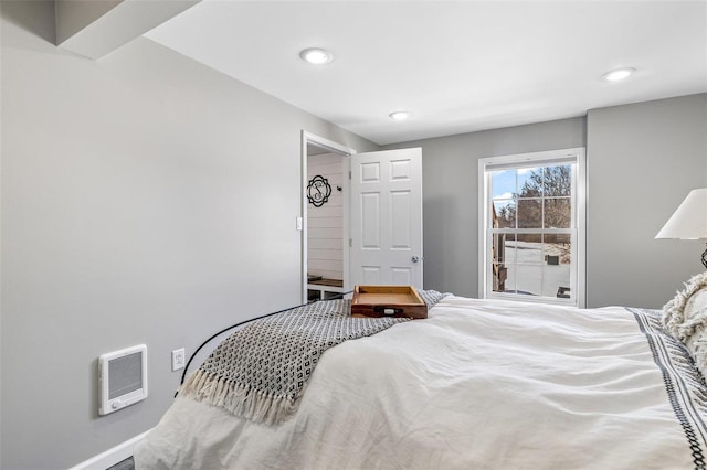 bedroom featuring heating unit