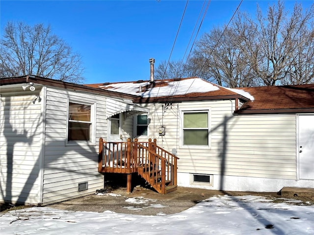 view of snow covered house