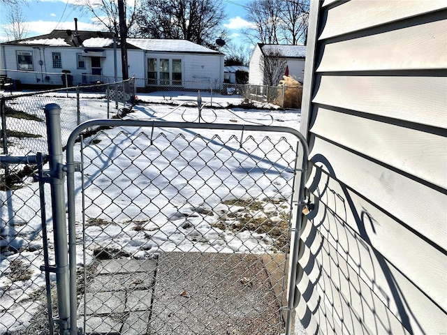 view of snow covered gate