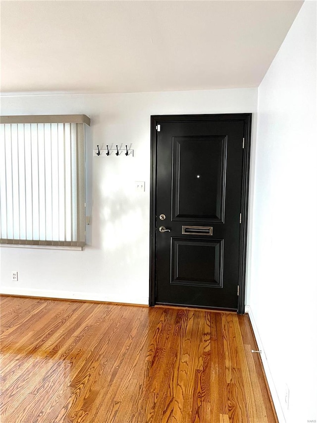 doorway to outside with light wood-type flooring