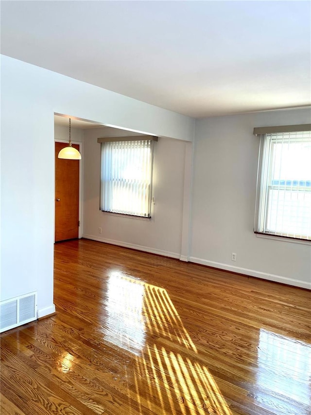 unfurnished room featuring dark hardwood / wood-style floors