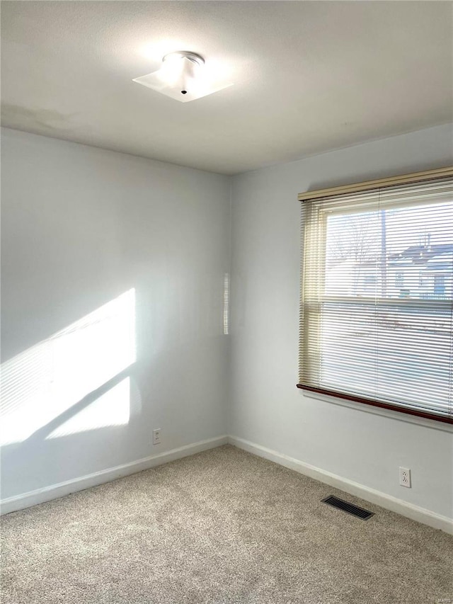 empty room featuring carpet flooring