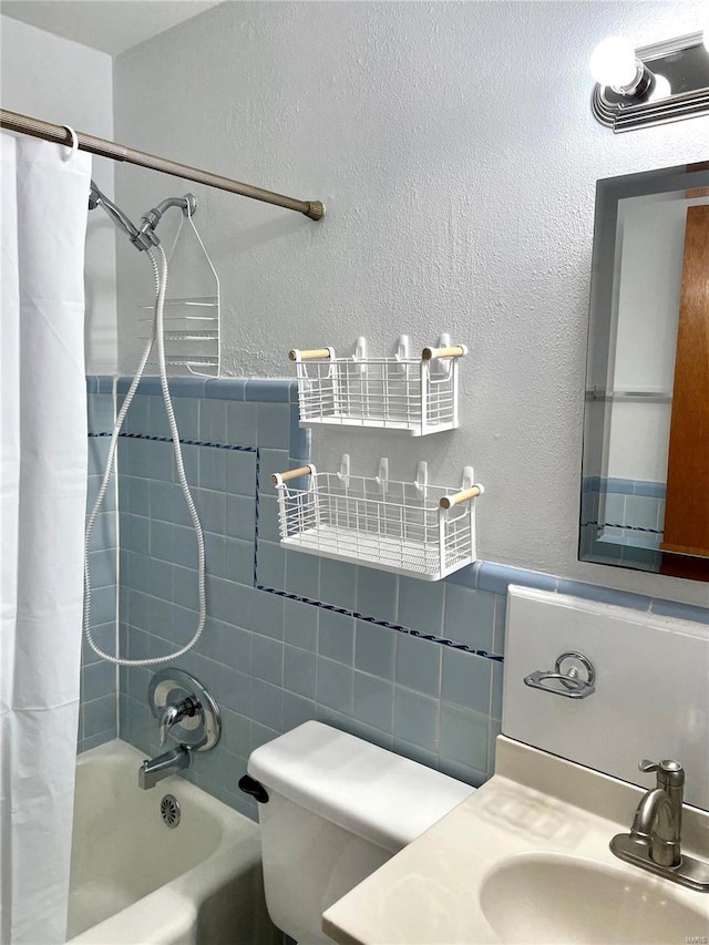 full bathroom with vanity, toilet, and shower / tub combo with curtain