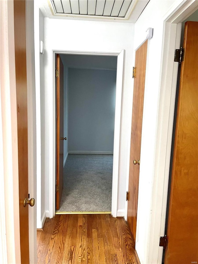 corridor featuring hardwood / wood-style flooring